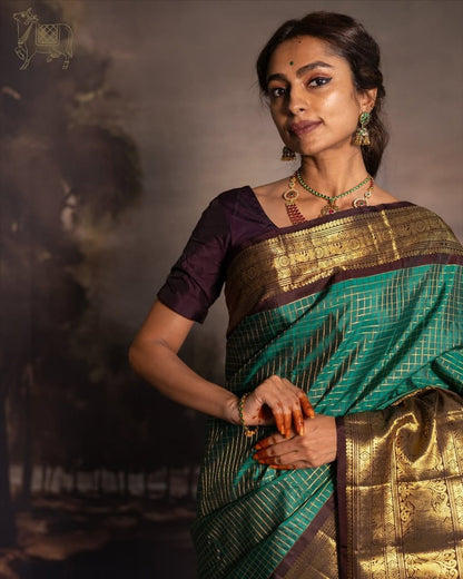 Green & Purple Kanjivaram Silk Saree with Rich Zari Border & Traditional Peacock Motifs