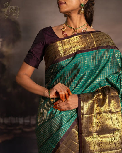 Green & Purple Kanjivaram Silk Saree with Rich Zari Border & Traditional Peacock Motifs