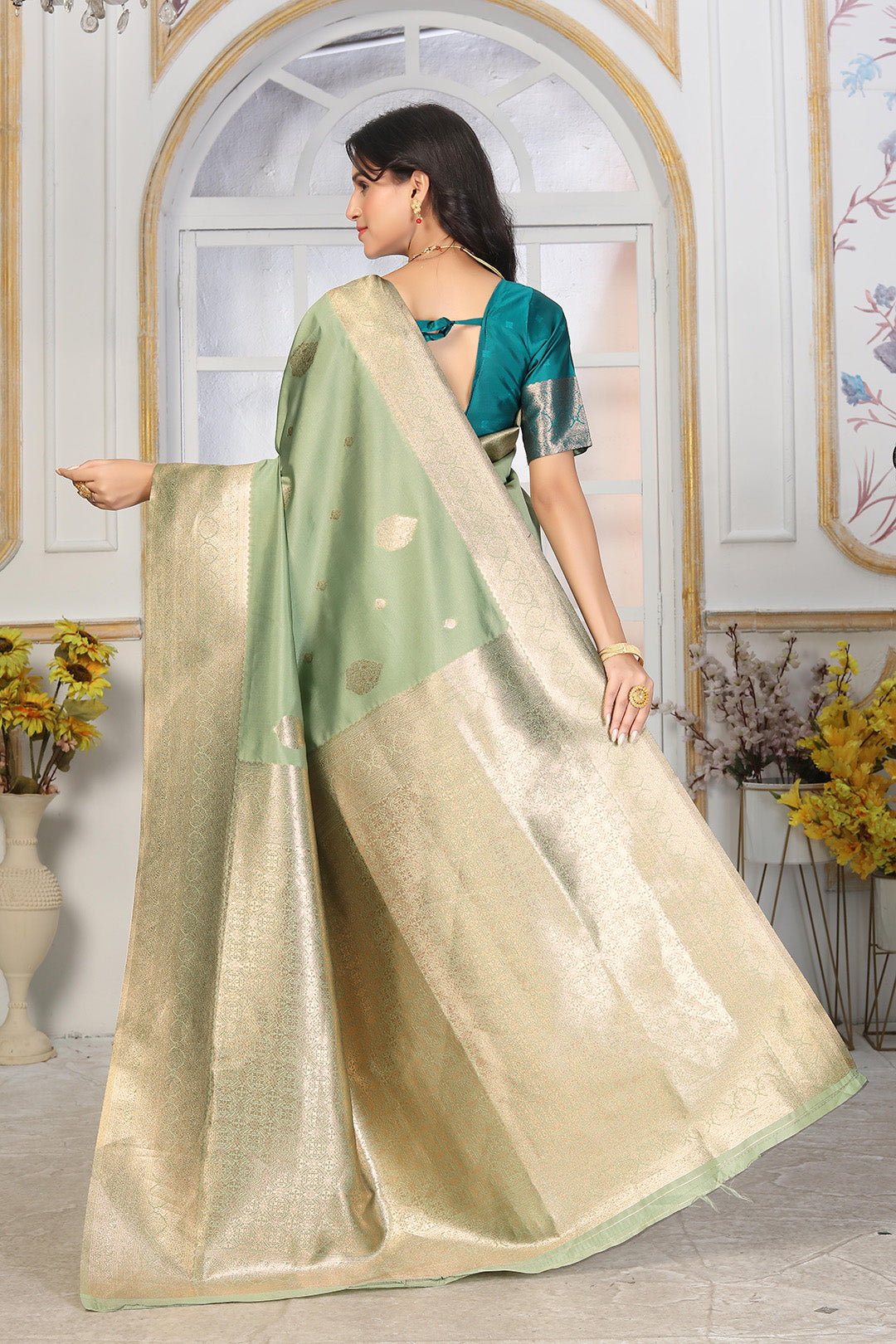 Pastel Pistachio Green Jacquard Silk Saree with Gold Zari & Teal Contrast Blouse