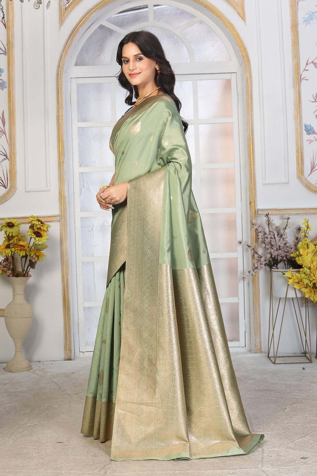 Pastel Pistachio Green Jacquard Silk Saree with Gold Zari & Teal Contrast Blouse