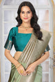 Pastel Pistachio Green Jacquard Silk Saree with Gold Zari & Teal Contrast Blouse