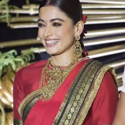 Celebrity-Inspired Red Silk Saree with Black & Gold Temple Border (Rashmika Wedding Style)