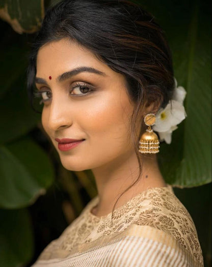 Graceful Cream Banarasi Soft Silk Saree with Gold Zari Weaving