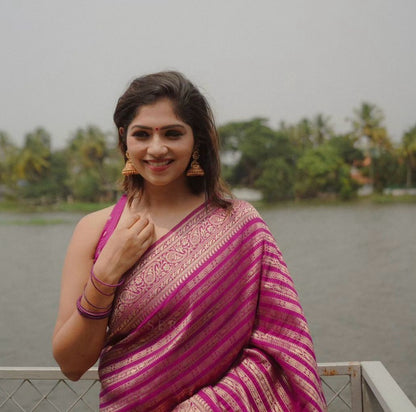 Radiant Magenta Banarasi Silk Saree with Golden Zari Stripes by StylistPot