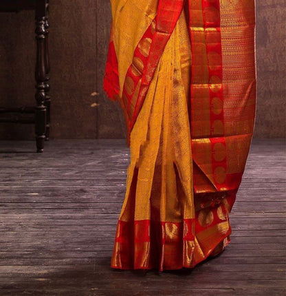 Golden Banarasi Soft Silk Saree with Traditional Zari Border and Red Blouse