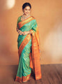 Sea Green Banarasi Soft Silk Saree with Vibrant Orange Border and Golden Zari Weaving
